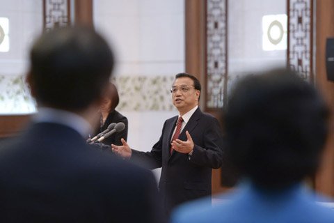 李克强:让来华外国专家享受国民待遇(图)