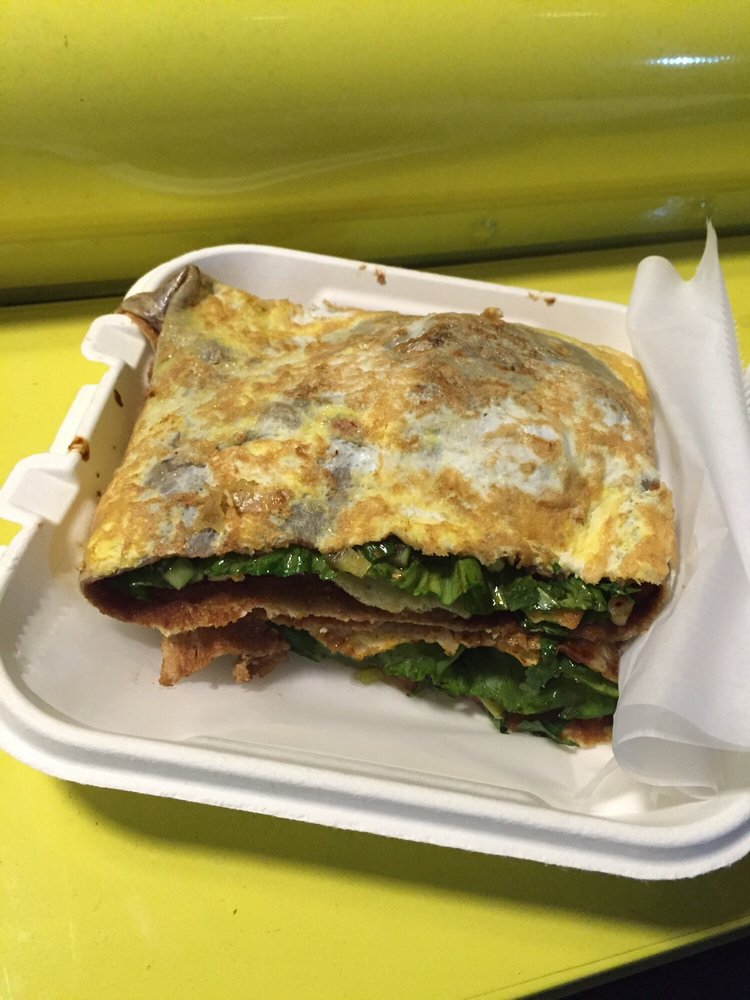 她们把煎饼果子卖到了美国 美媒:摊煎饼是门艺术